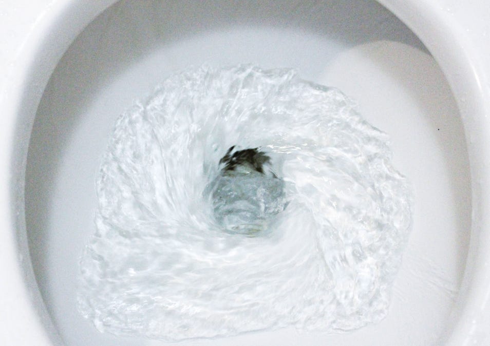 Flushing water in toilet bowl