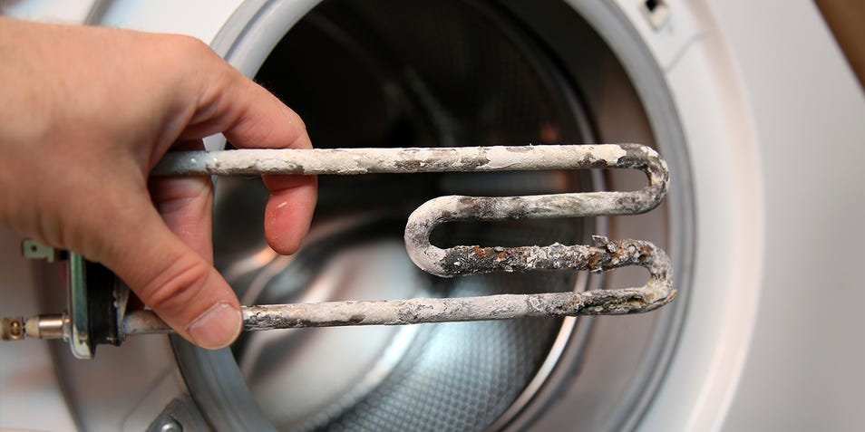How can I protect my washing machine and laundry from limescale build up? 