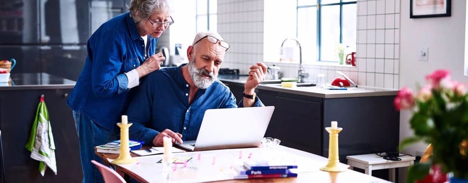 old couple looking at the computer