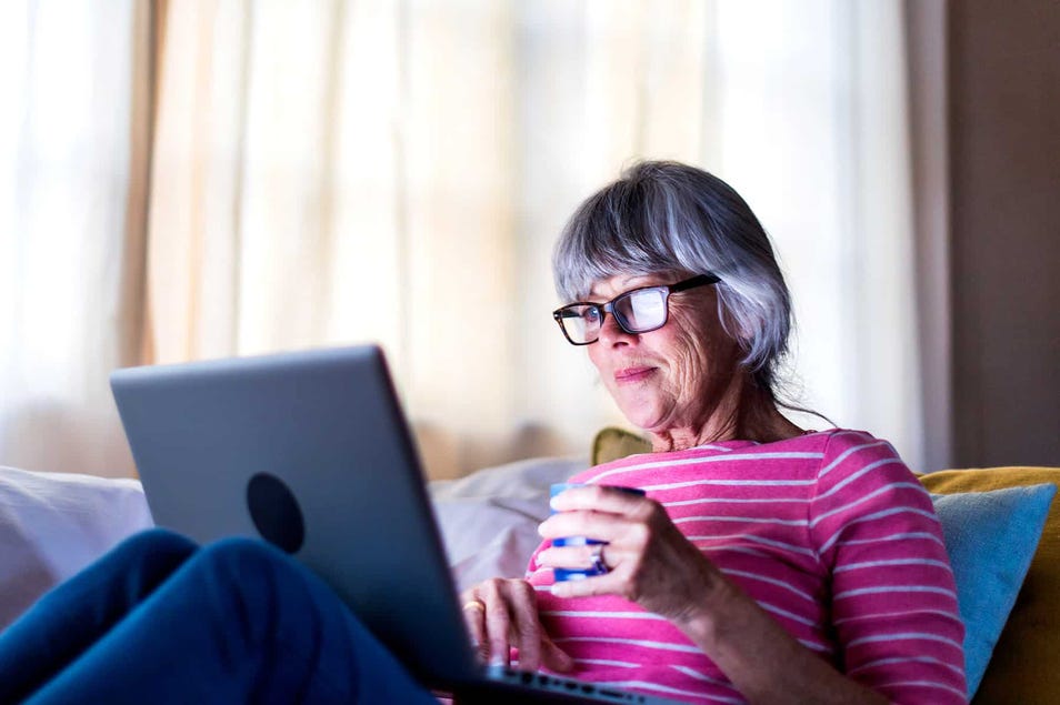  Female holding cap and reading from notebook