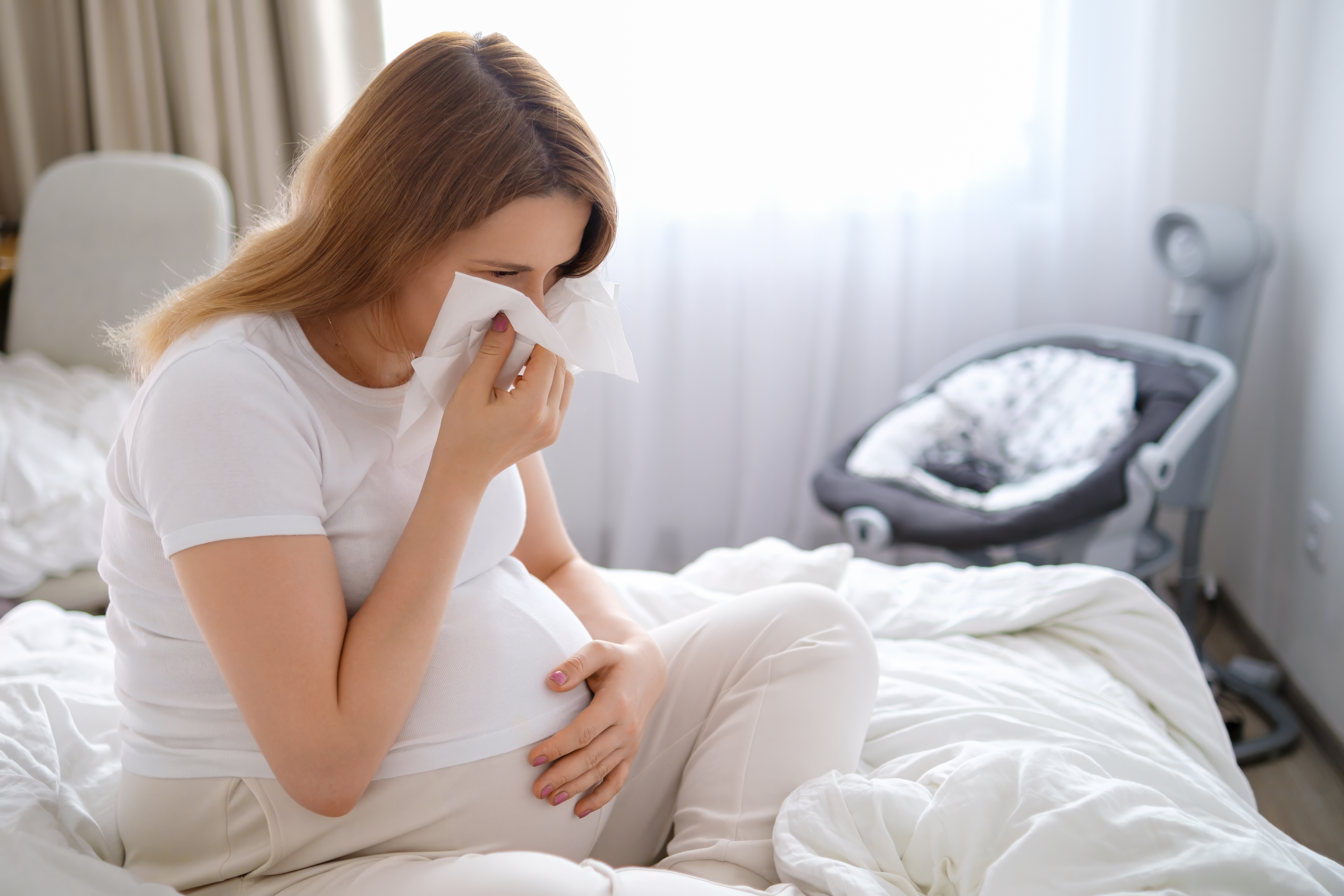Pregnant woman suffering from cold and flu