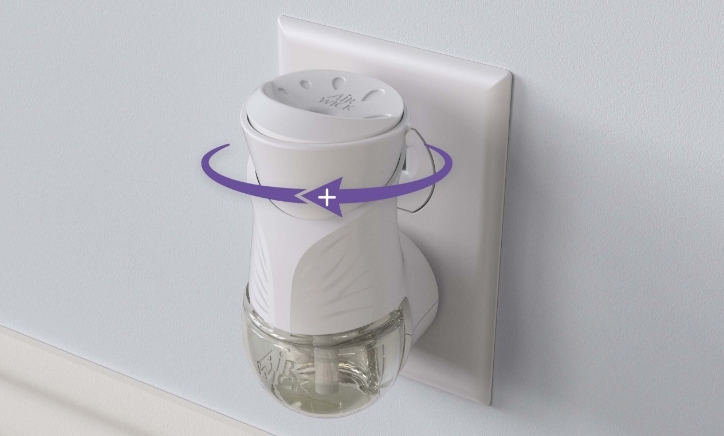 Displays the top Air Wick® Plug-in Scented Oil warmer with a zoomed in portion of the fragrance level setting.
