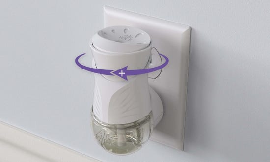 Displays the top Air Wick® Plug-in Scented Oil warmer with a zoomed in portion of the fragrance level setting.