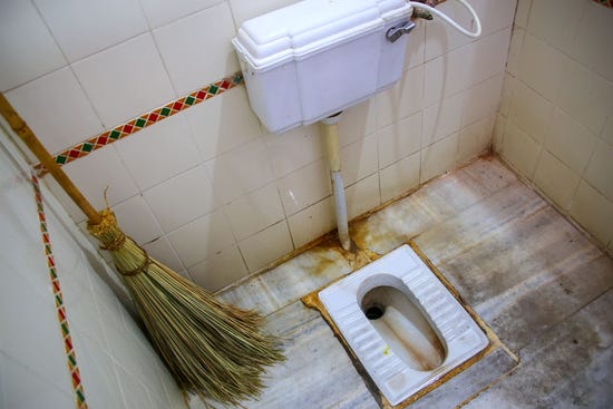 Rust stains on an Indian squat toilet