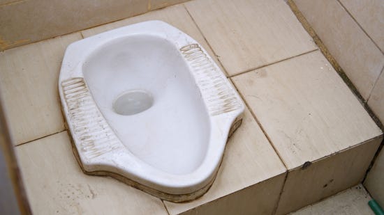 Dirty squat toilet