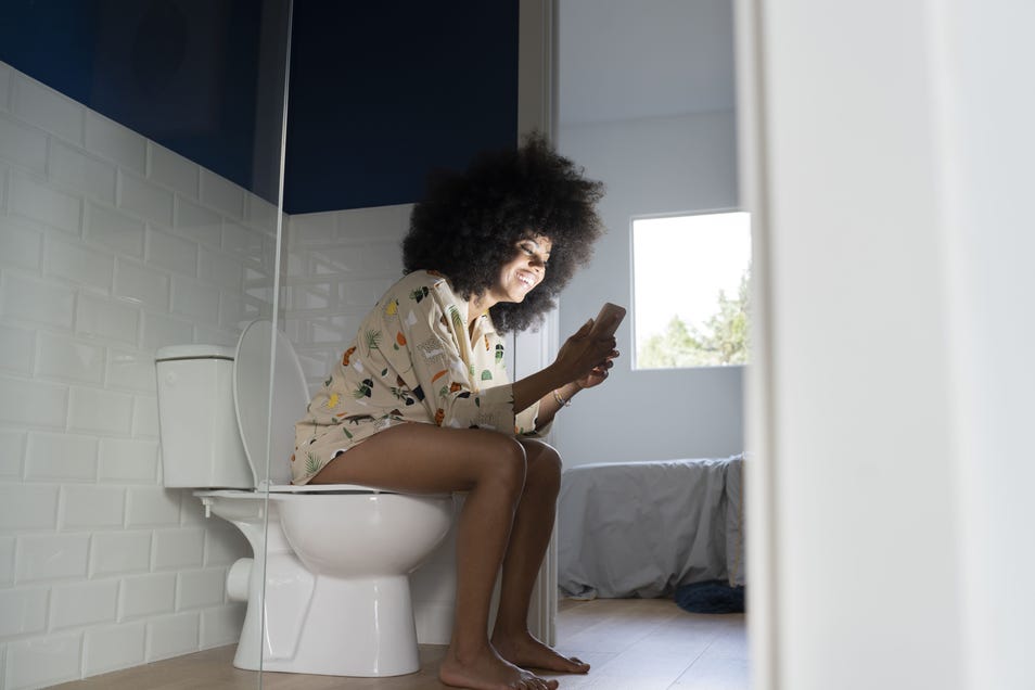A woman on a toilet 