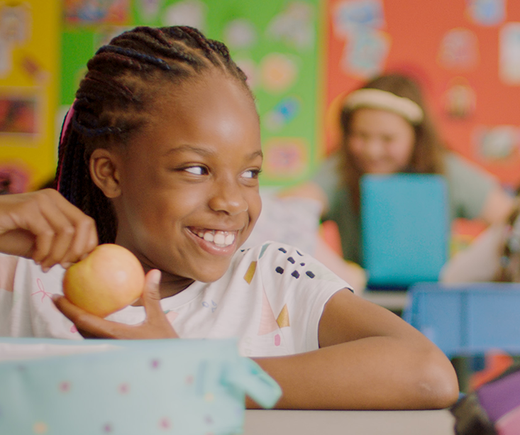 Static image from broadcast footage of a kid in cafeteria