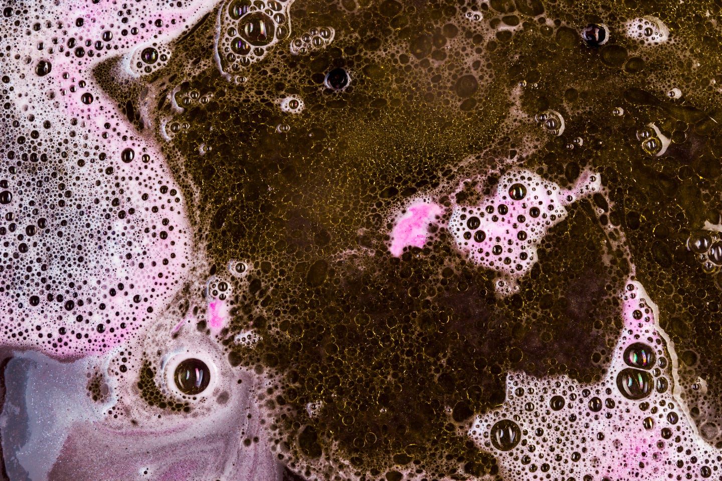 Pink and black suds mixing