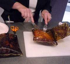179622-Ribs_cooked_in_Oven_Ease_Bag_being_cut_with_plastic_knife.jpg