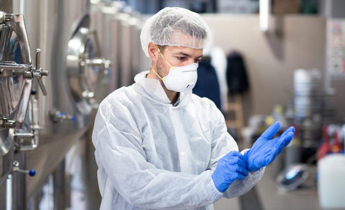 Pharma-gowning-young-technologist-putting-protective-rubber-gloves-production-factory-freepik-web.jpg