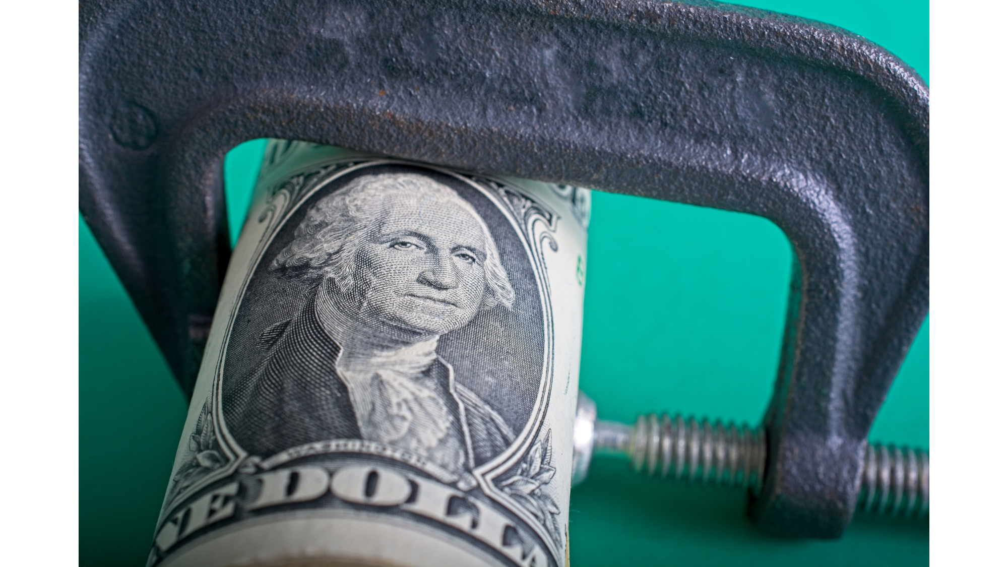 A US dollar being squeezed by a vice to illustrate pricing pressures