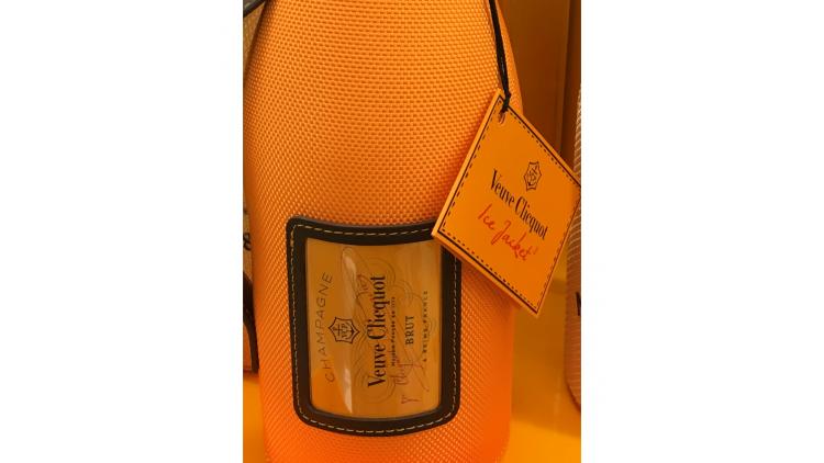 Champagne bottles dress up for the holidays