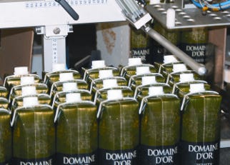 287887-A_case_packer_assembles_and_wraps_a_paperboard_blank_around_24_individual_paper_bottles_or_six_four_packs_.jpg 287887-A_case_packer_assembles_and_wraps_a_paperboard_blank_around_24_individual_paper_bottles_or_six_four_packs_.jpg