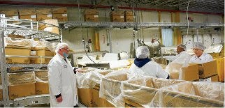 291669-Kevin_Helman_left_oversees_operation_of_the_bakery_s_new_packaging_installation_.jpg