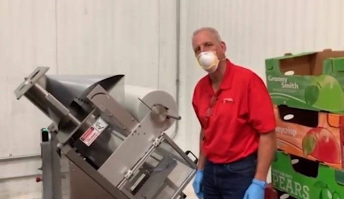 John Kreger and the Montgomery County Food Bank bagging machine