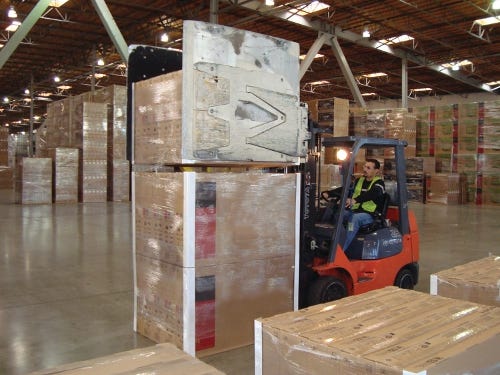 298288-In_its_distribution_center_Sony_easily_separates_factory_packed_pallet_loads_with_a_clamp_truck_to_ship_different_counts_to.jpg