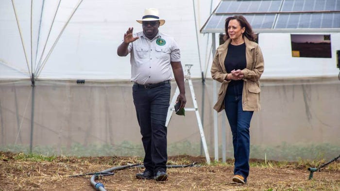 Panuka Farm owner Bruno Mweemba and US Vice President Kamala Harris walking and talking. Panuka Farm owner Bruno Mweemba and US Vice President Kamala Harris walking and talking.