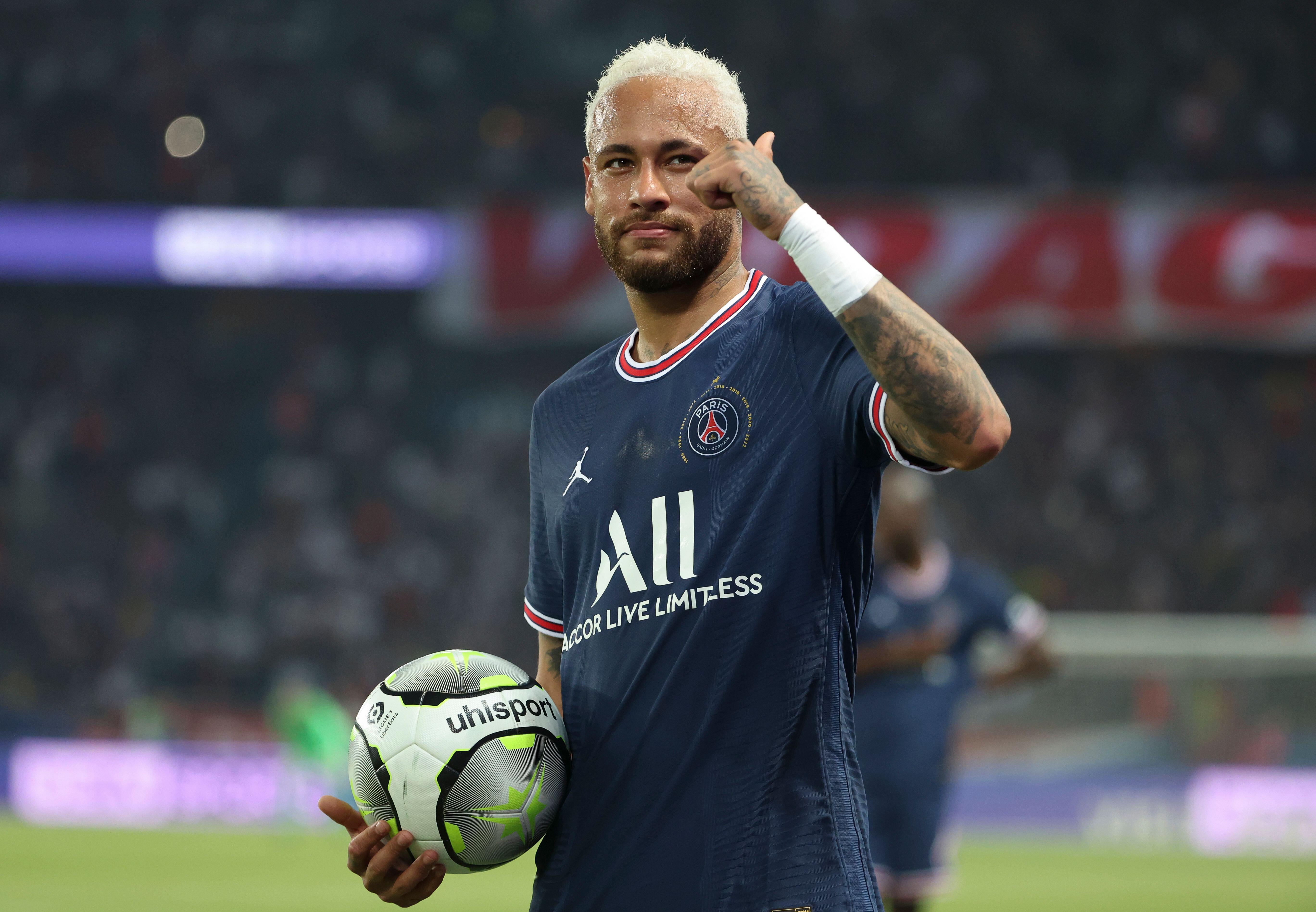 Gregory van der Wiel, left, and Marquinhos of Paris Saint-Germain football  club prepare to cut the ribbon during the opening ceremony for the Pop up S  Stock Photo - Alamy