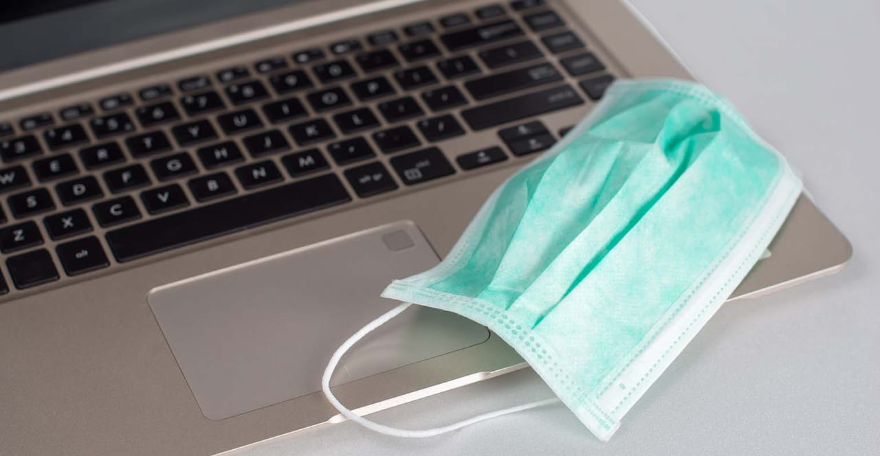 Mask For A Computer Managing Retirement Plans Through the Pandemic