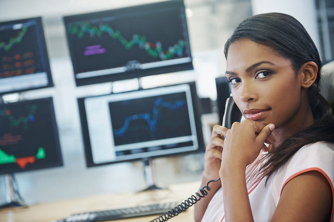 Lady with a phone dealing in stocks