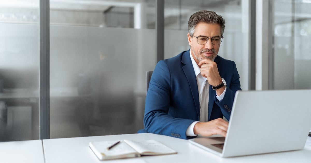 man with a nice suit on working on the computer
