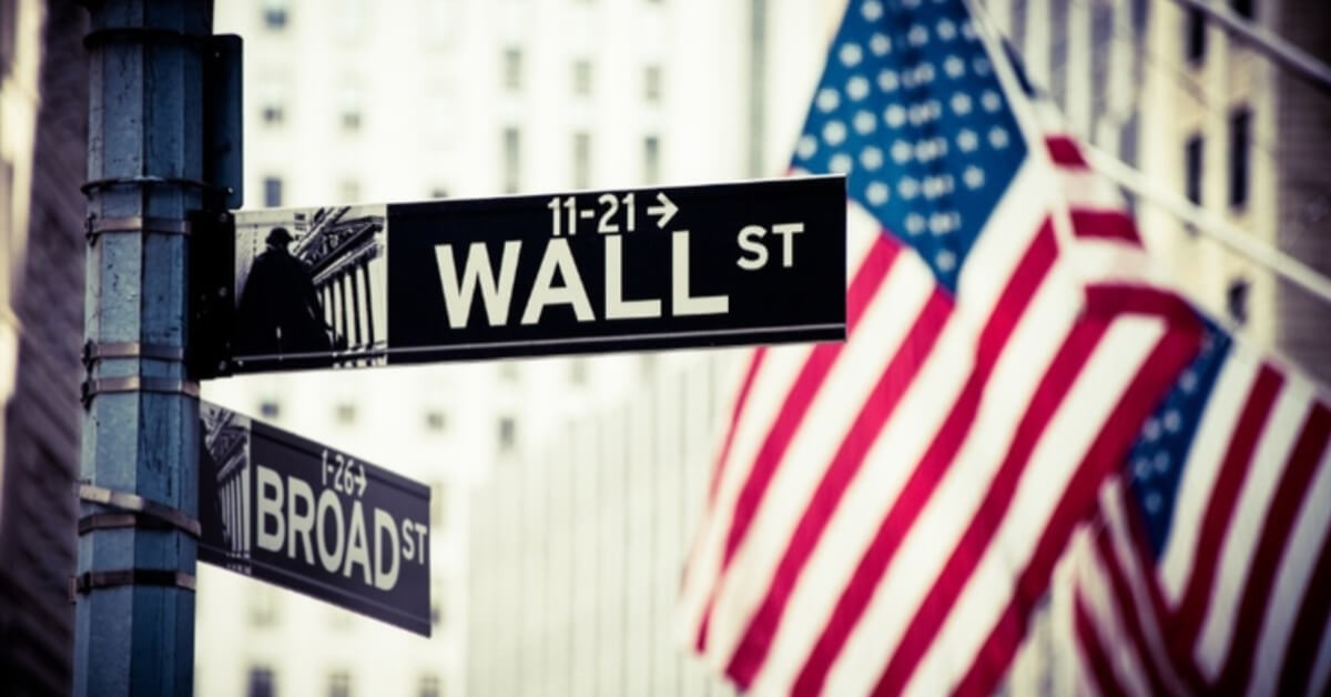 Wall street with american flag road street