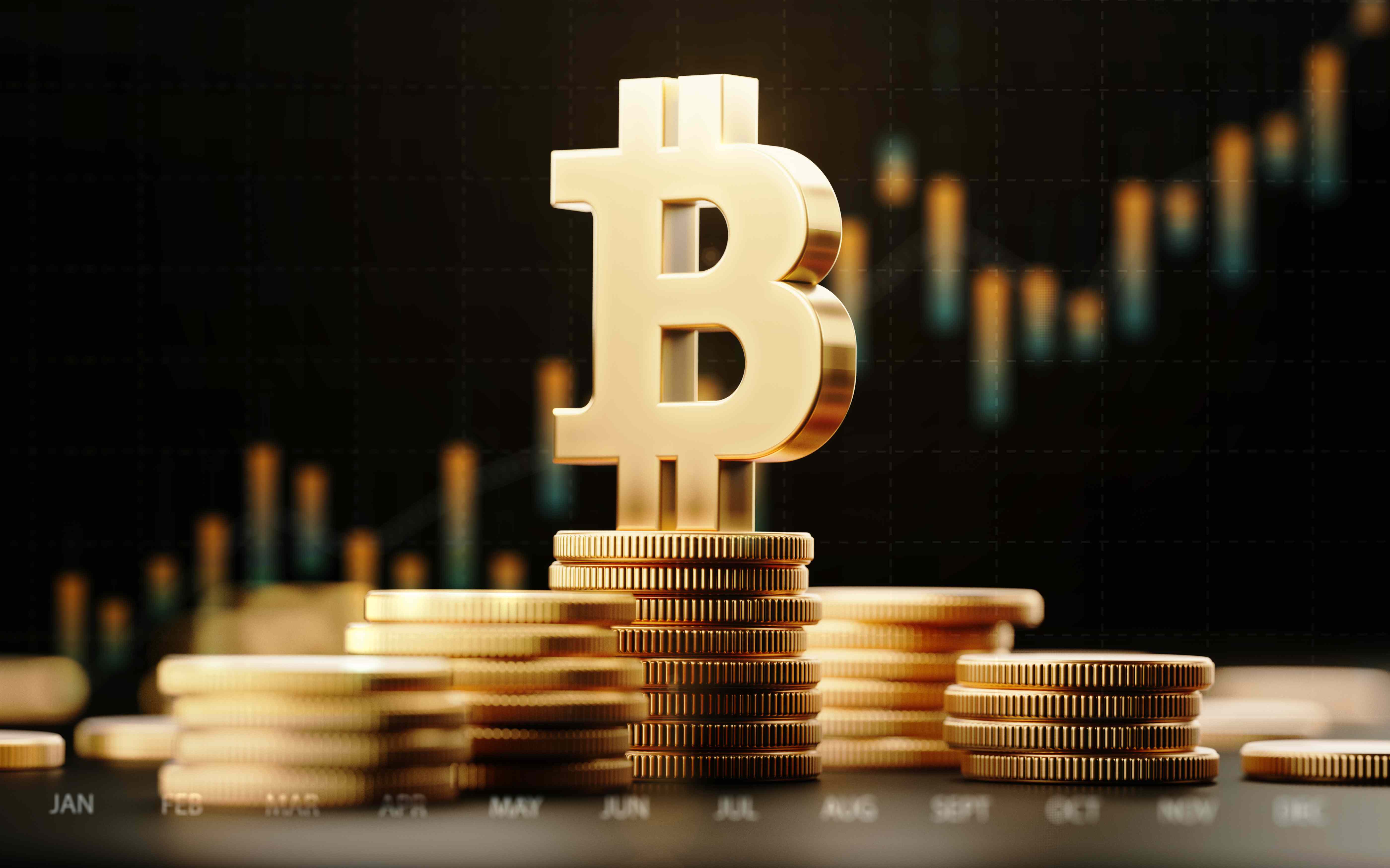 Gold bitcoin logo on stack of gold Bitcoin tokens