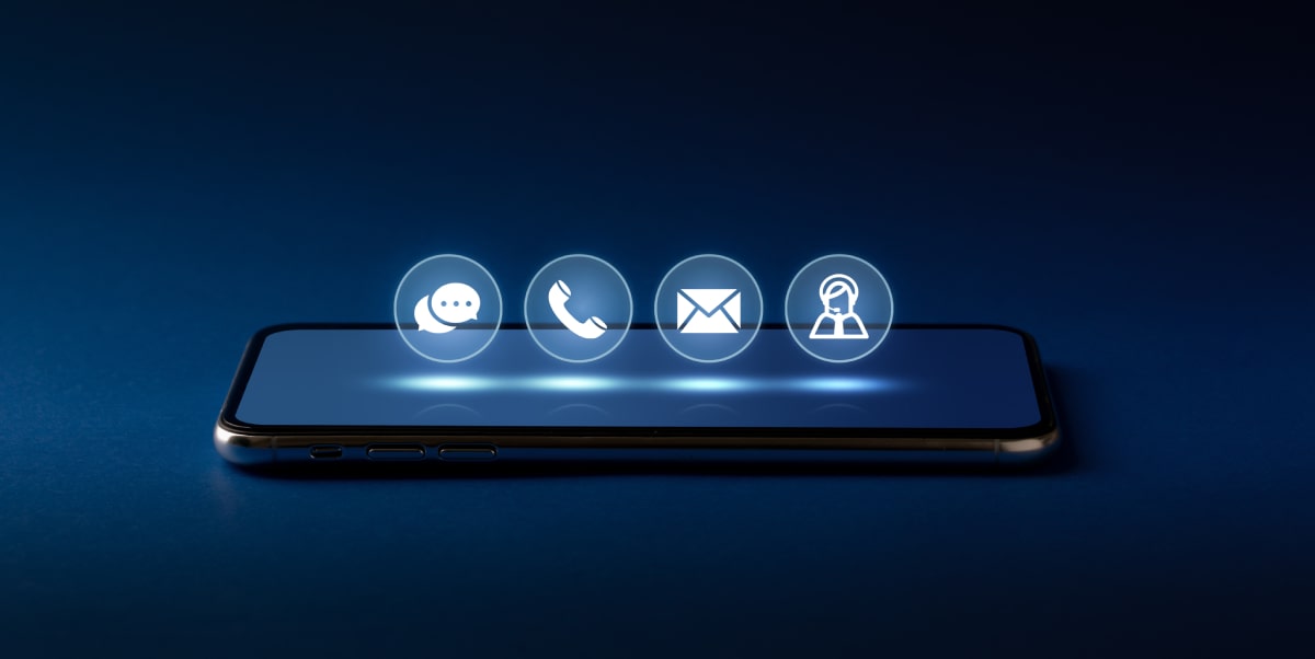 contact us icons overlaying a mobile phone