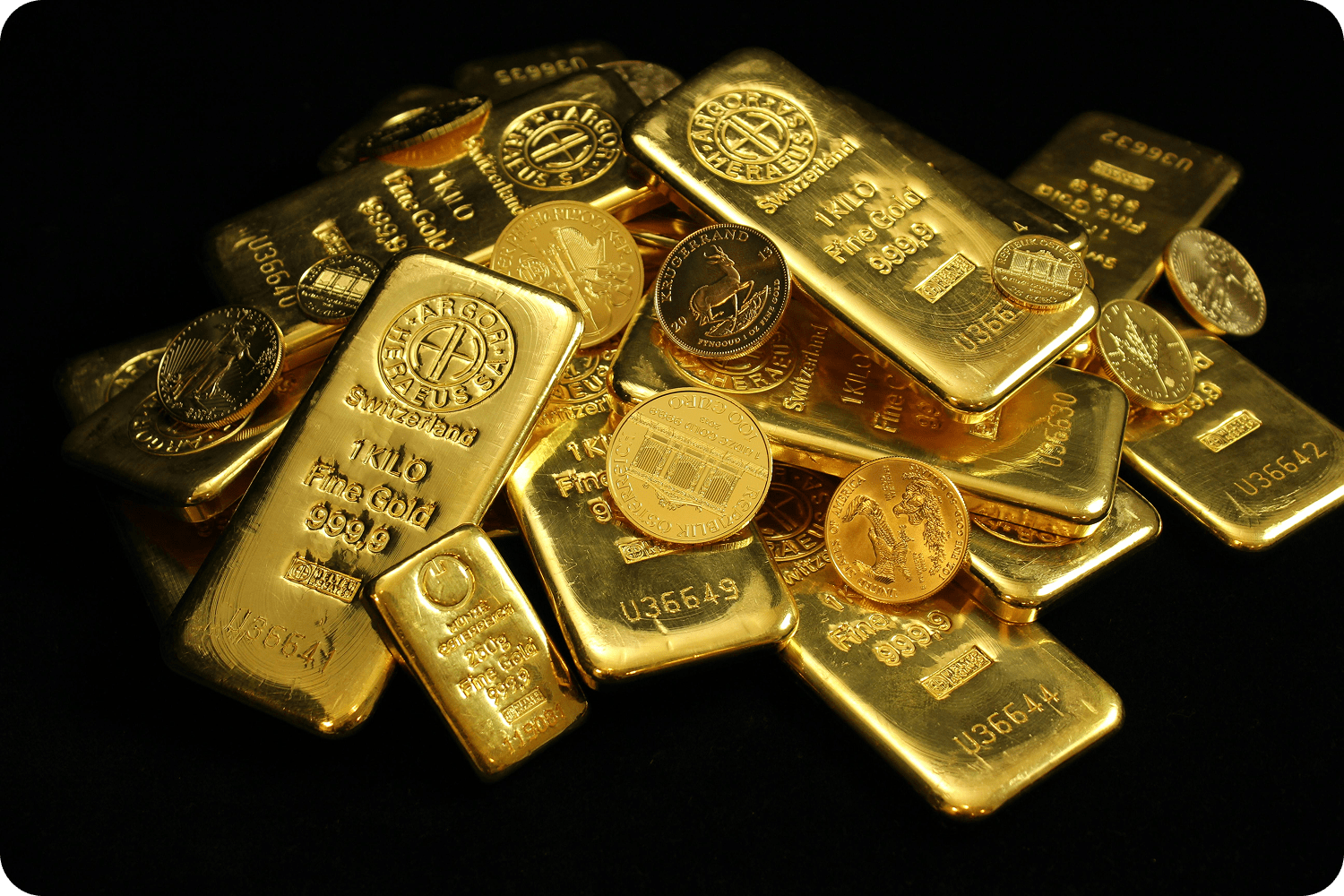 Two gold bars displayed on a dark surface, with a blue graphic overlay reading