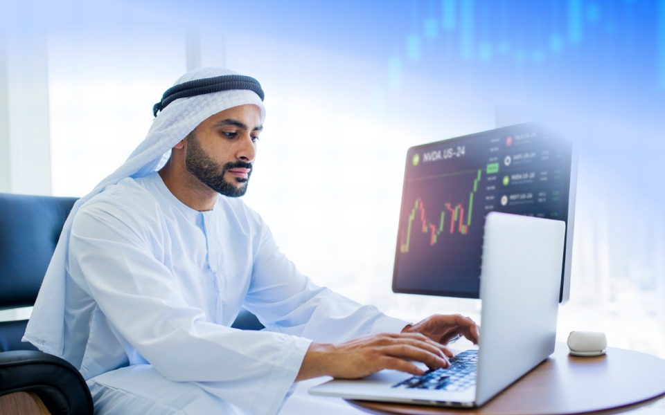 man sitting in front of laptop