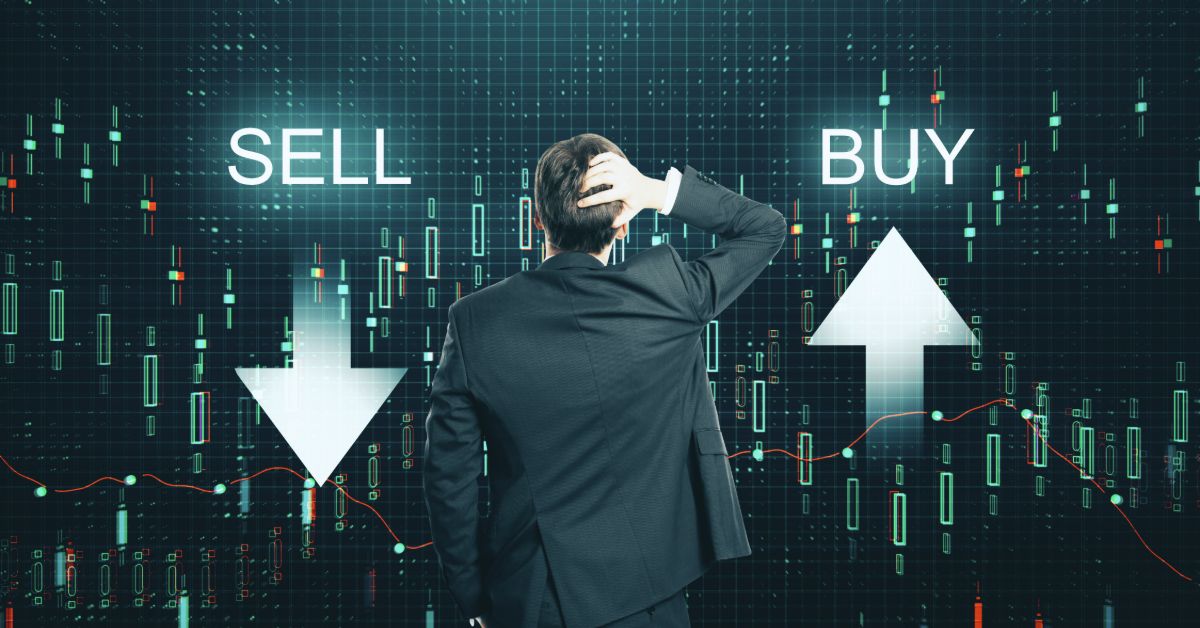 a man in a suit looking at the sell and buy arrows.jpeg