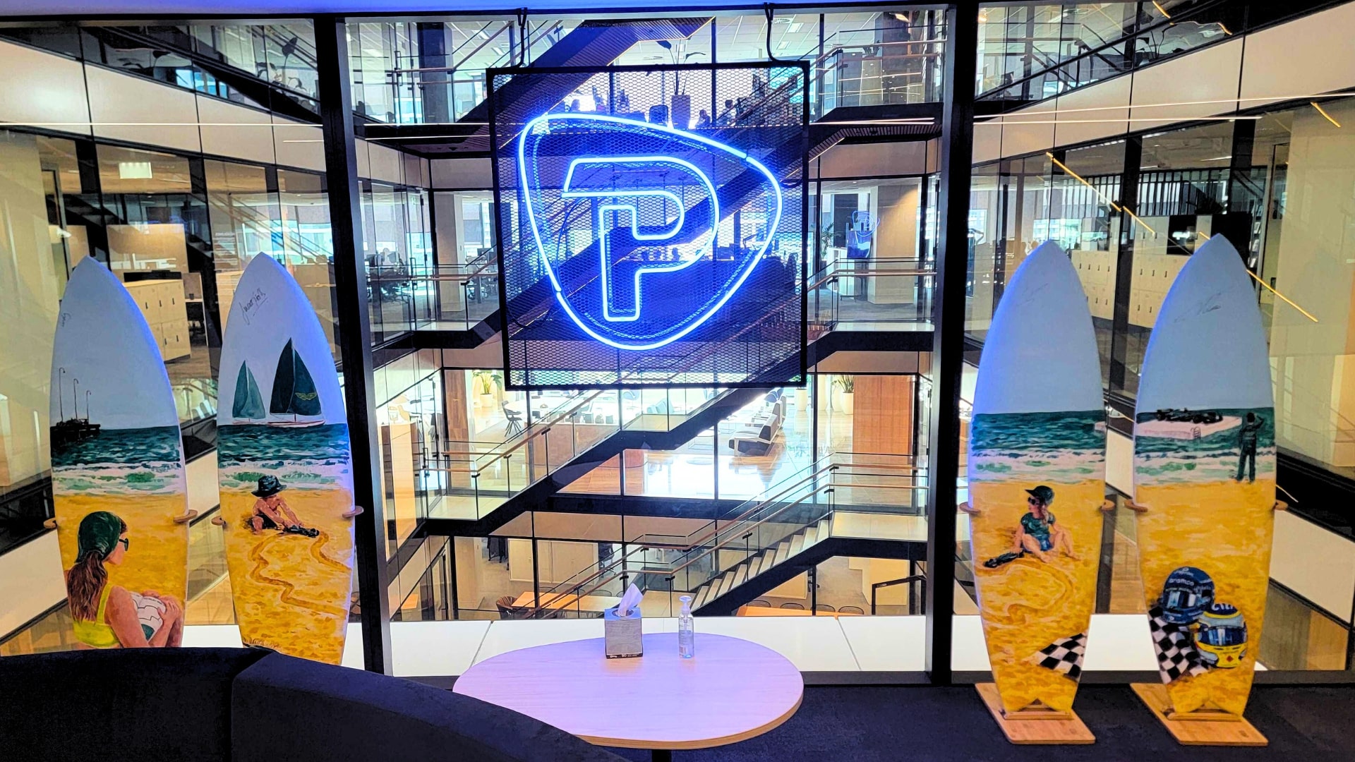 Four custom painted surfboards commissioned by the Aston Martin Aramco Formula One Team and Pepperstone—stand proudly at our Melbourne HQ, bringing a bold splash of colour and creativity to the entrance.jpg