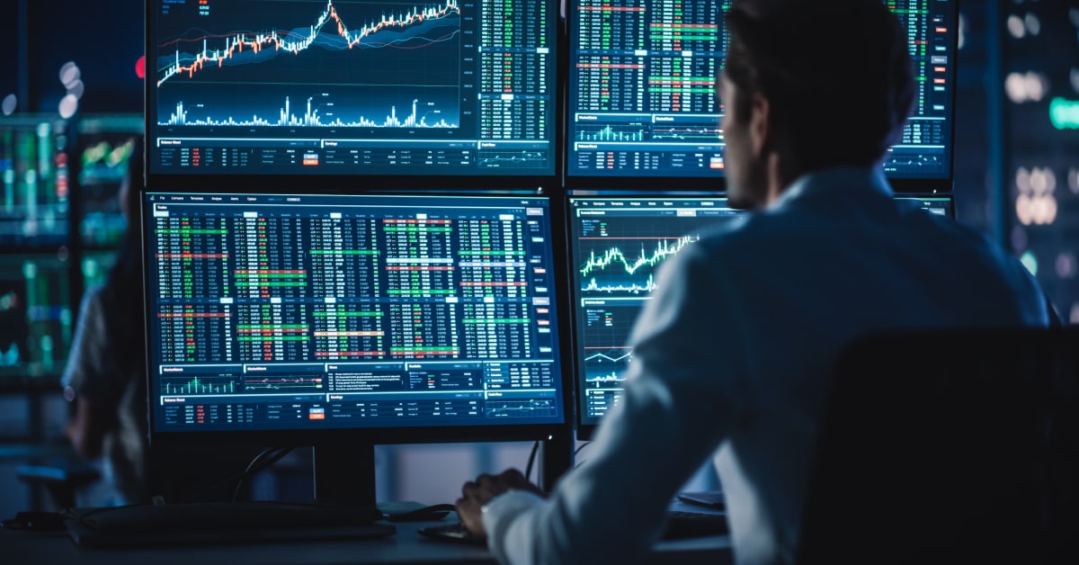 man trading on multiple monitors.jpg