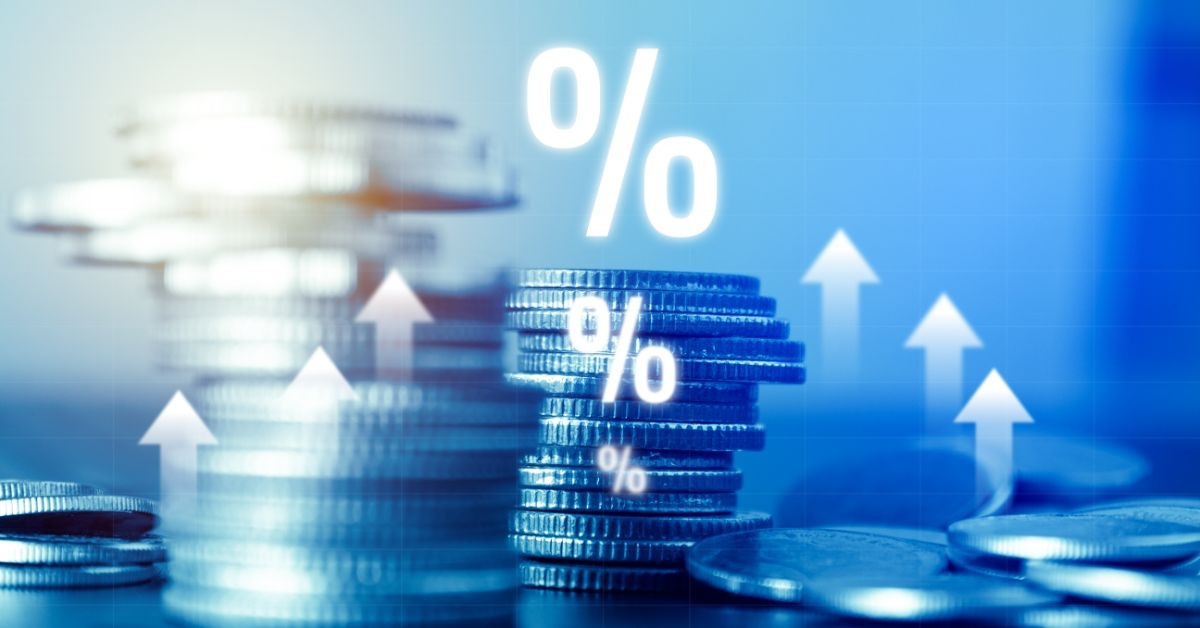 a stack of coins with a percentage sign.jpeg