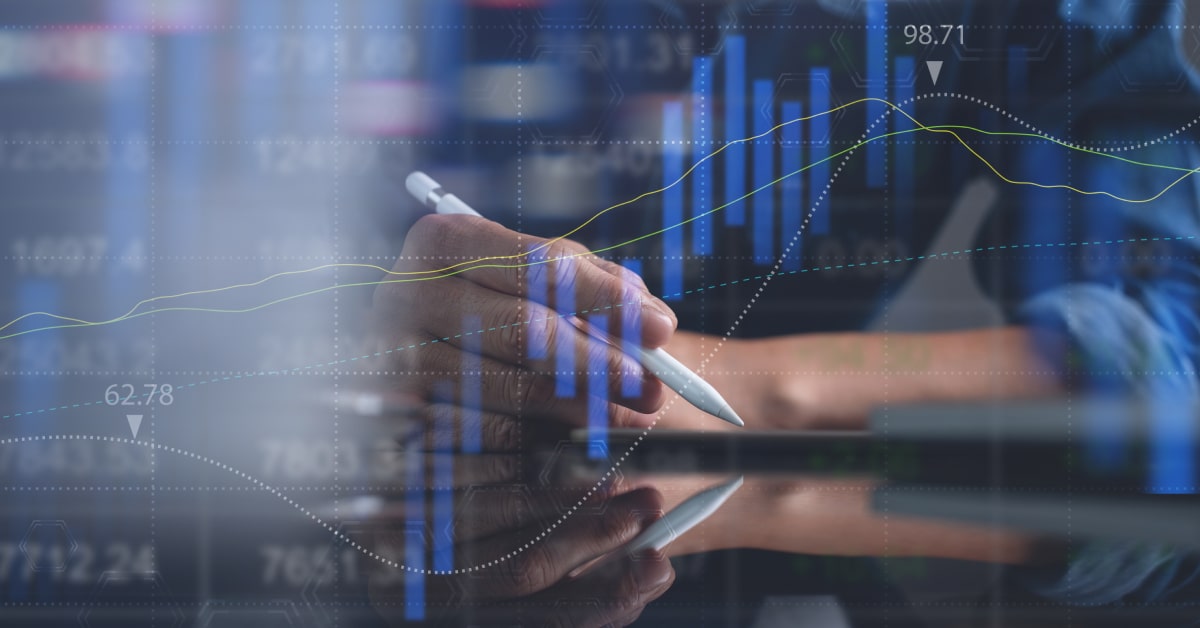 hand with pen and trading graph.jpg