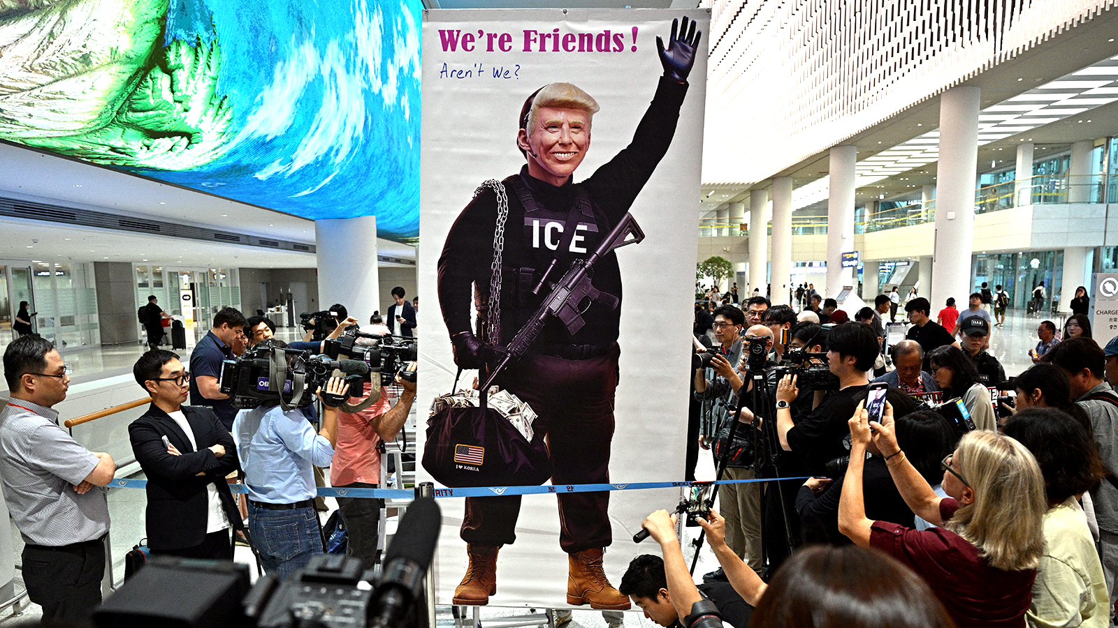 Banner protesting the ICE raid at Hyundai's Georgia battery plant, displayed at Incheon International Airport