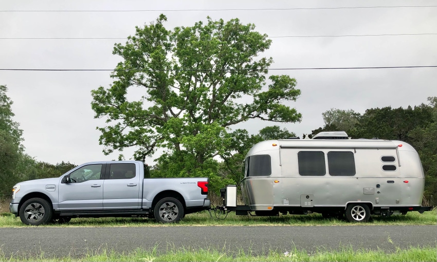 Ford F-150 Lightning pickup towing an Airstream travel trailer.