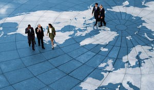 Stock image: Businesspeople on a world map