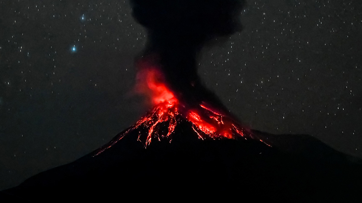 Thousands flee as Indonesian volcano spews ash 11 miles into the air