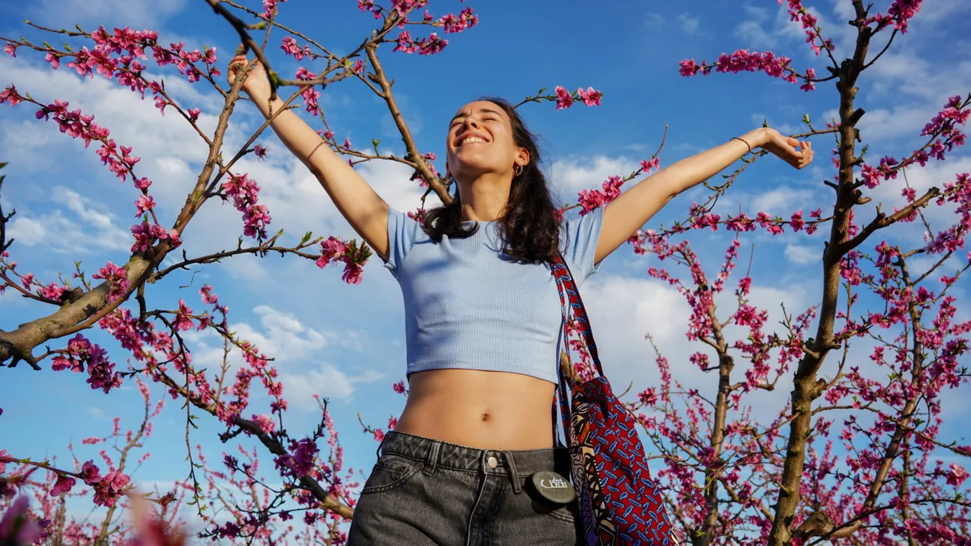 Happy woman with a tree background Happy woman with a tree background