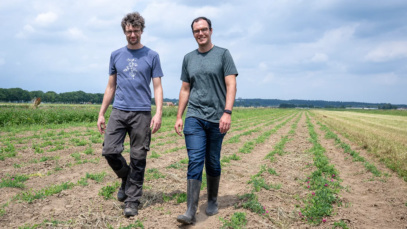 Aardaia co-founders Pádraic Flood (left) and Mike Henske (right) walking in crop field. Aardaia co-founders Pádraic Flood (left) and Mike Henske (right) walking in crop field.