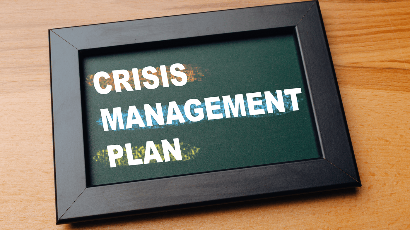 Crisis management plan written in photoframe Crisis management plan written in photoframe