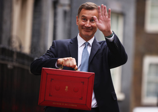 Chancellor of the exchequer Jeremy Hunt leaves Downing Street with his red budget box