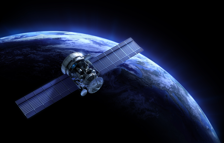 A satellite in orbit above the Earth. A satellite in orbit above the Earth.