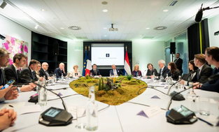 Global leaders at a meeting of the trilateral quantum initiative. 