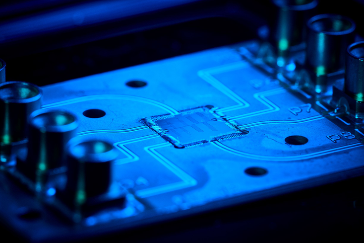 A blue-lit computer chip A blue-lit computer chip