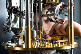 A researcher working on quantum computer components