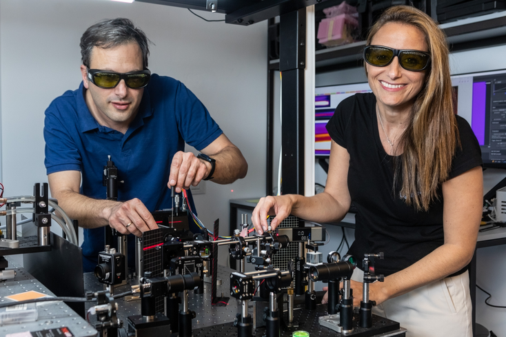 A woman holds lit-up optical Fibers A woman holds lit-up optical Fibers