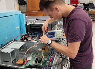 A Quantum Brilliance scientist works on computer circuits