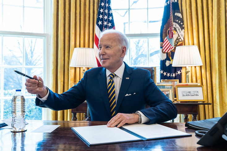 President Biden signs documents at his Oval Office desk President Biden signs documents at his Oval Office desk